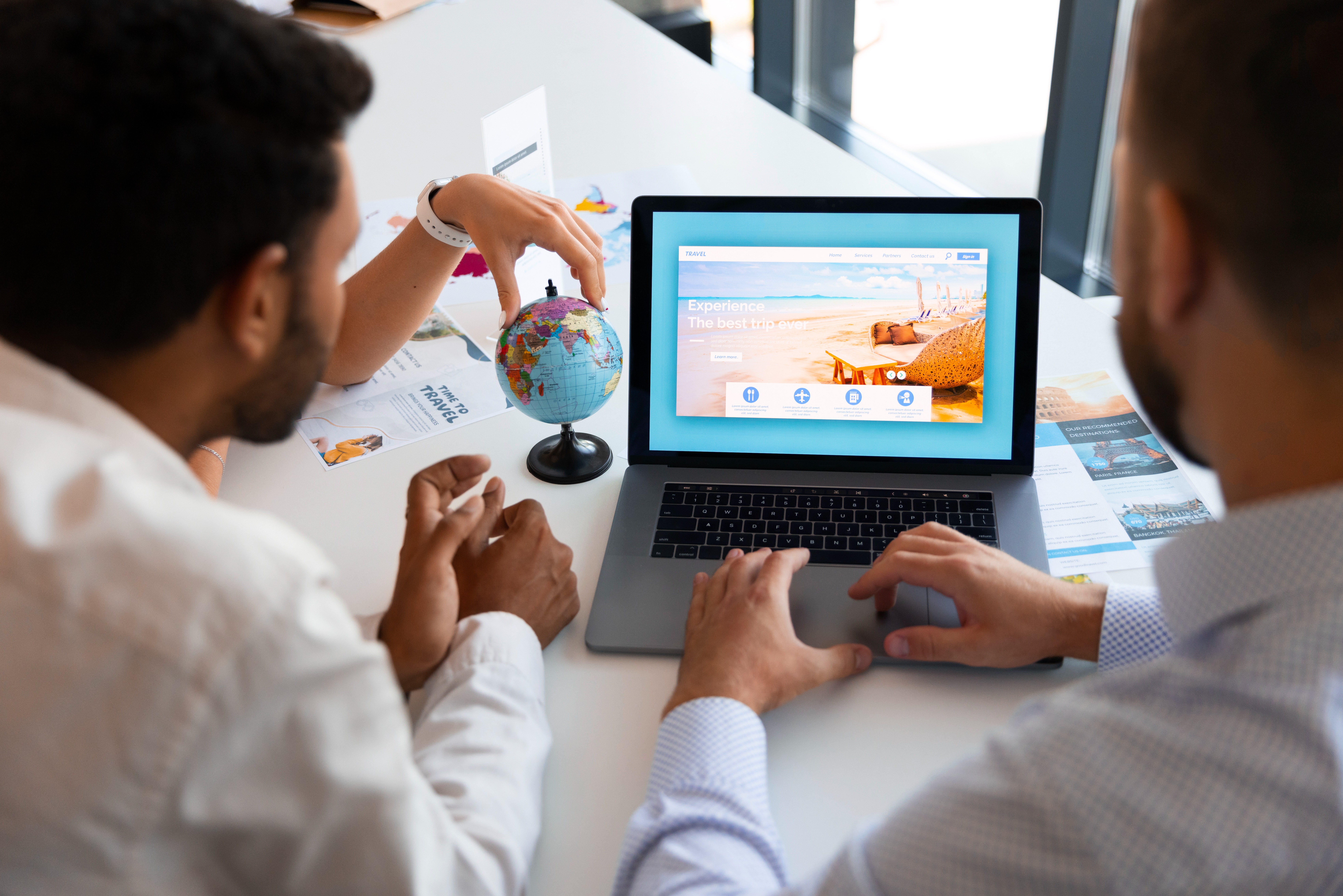 Tow professional men typing on a laptop